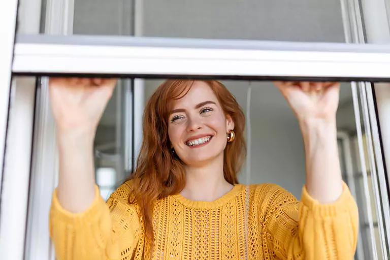 lady opening a window